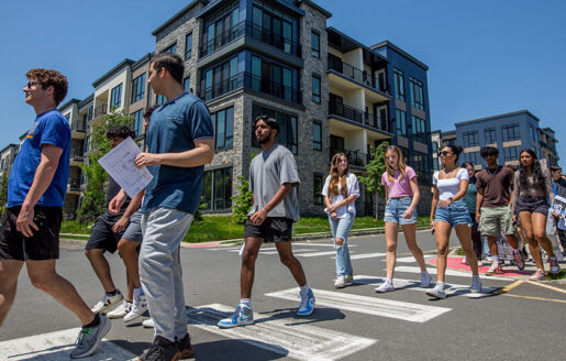 Students from East Brunswick High School, ranging from sophomores to seniors, on a field trip to Russo Development's Vermella Woodbridge